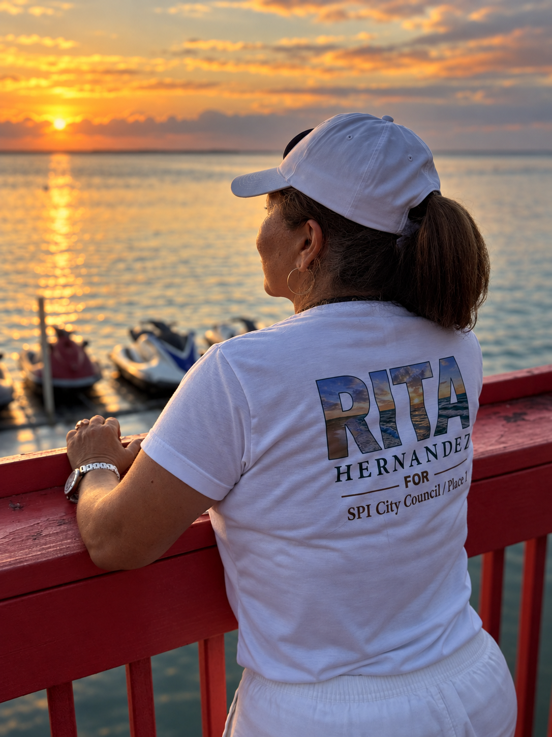 Rita Hernandez at sunset on South Padre Island in her campaign shirt